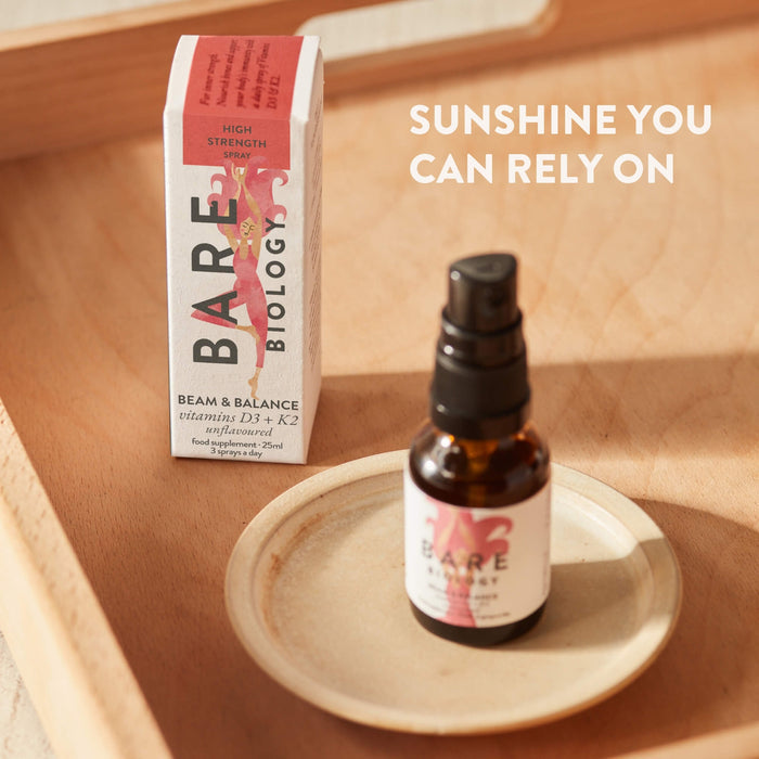 Bare Biology Beam and Balance Unflavoured product displayed on a ceramic dish on a tray next to the carton.