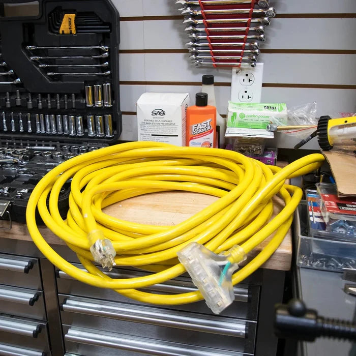DuroMax 25-Foot 10 Gauge Triple Tap Extension Power Cord Lying On A Tool Chest
