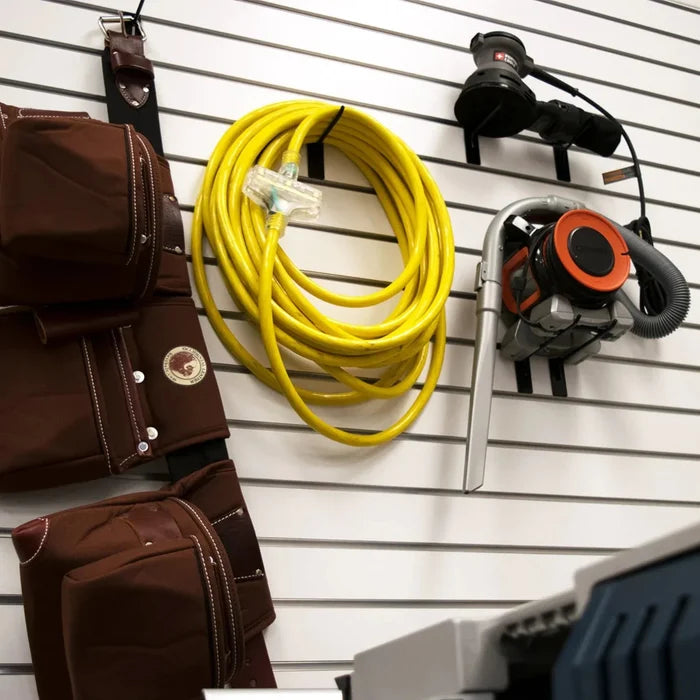 DuroMax 50-Foot 10 Gauge Power Cord Hanging On A Garage Wall