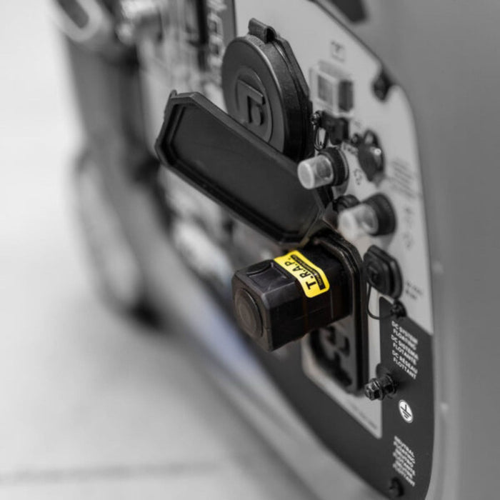 Close-Up View Of A Plugged-In Faraday Defense T.R.A.P. AC In a Portable Generator