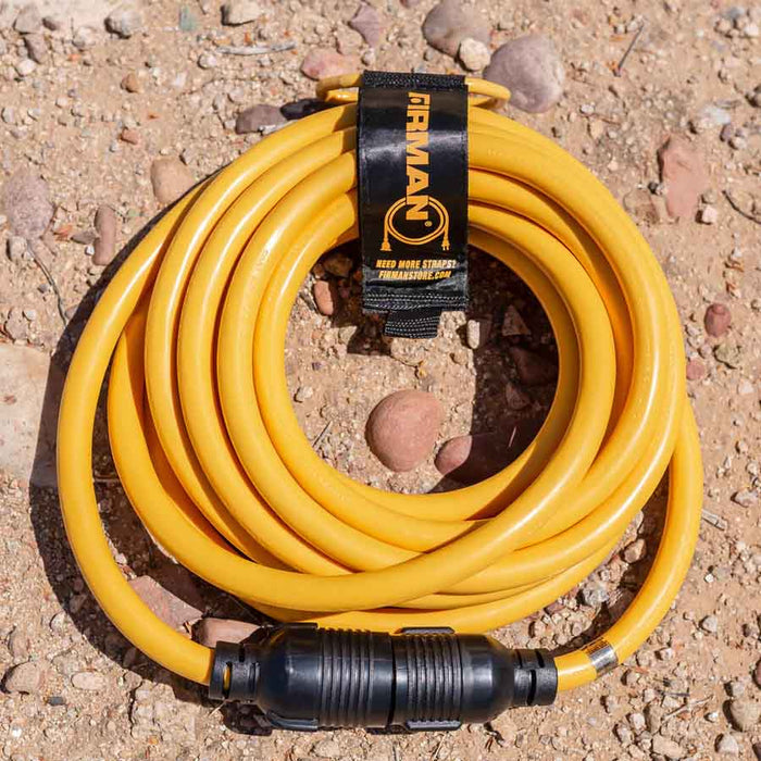 Firman 25' Heavy Duty L14-30P to L14-30R Power Cord Extension With Storage Strap On The Ground