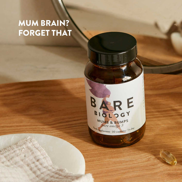 Jar of Bare Biology Mums and Bumps omega-3 supplements on a wooden surface with text 'Mum Brain? Forget That'.