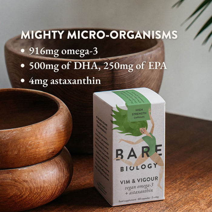 Box of Bare Biology supplement with wooden bowls in the background